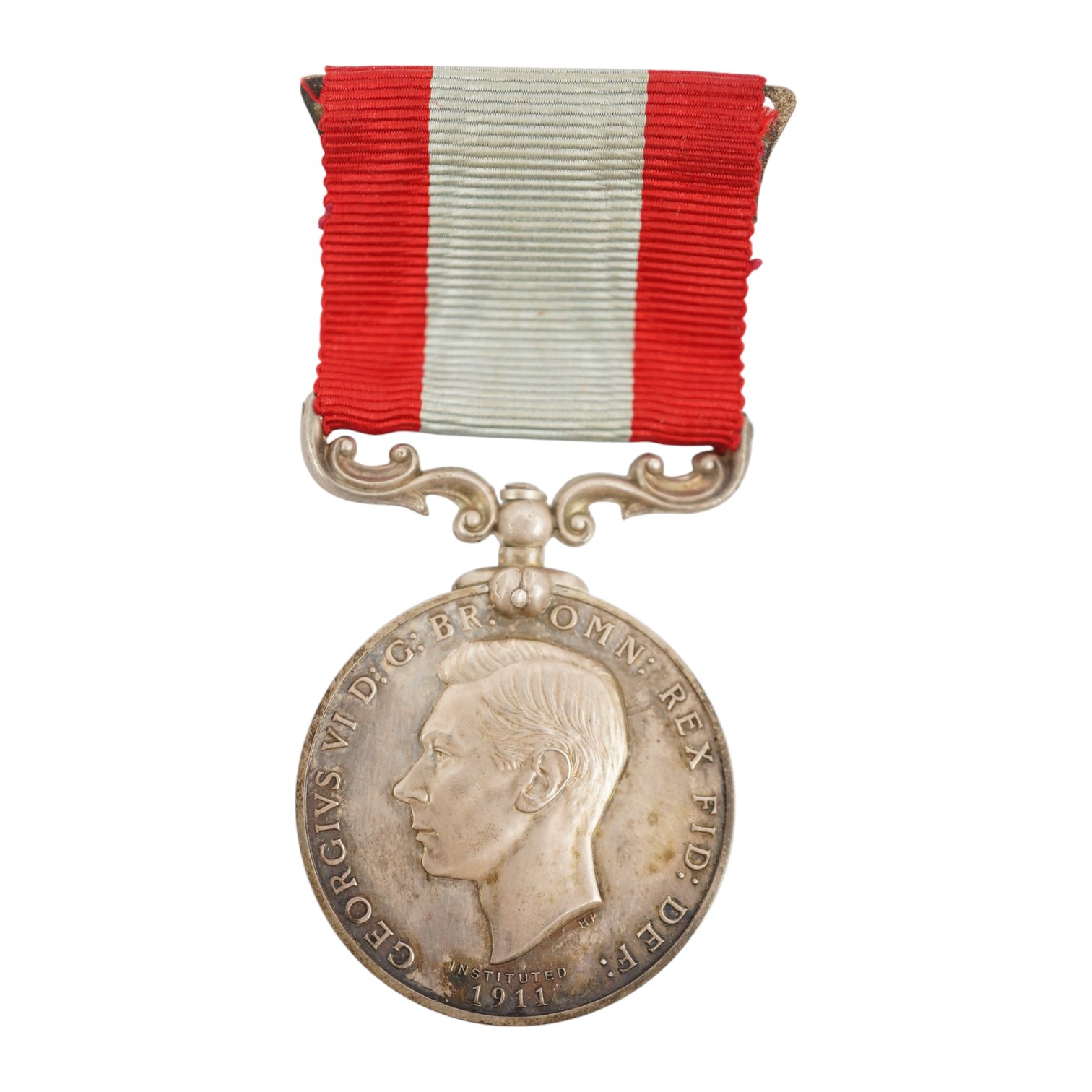 A cased George VI Rocket Apparatus Volunteer Medal Long Service Medal awarded to Harry Charles Palmer. Condition - poor to fair, hinge on the case is broken.